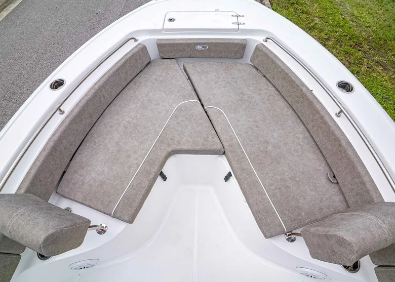 Slide: The Image of 2026 Sea Hunt Ultra 229 boat with spacious cushioned seating area. - 20