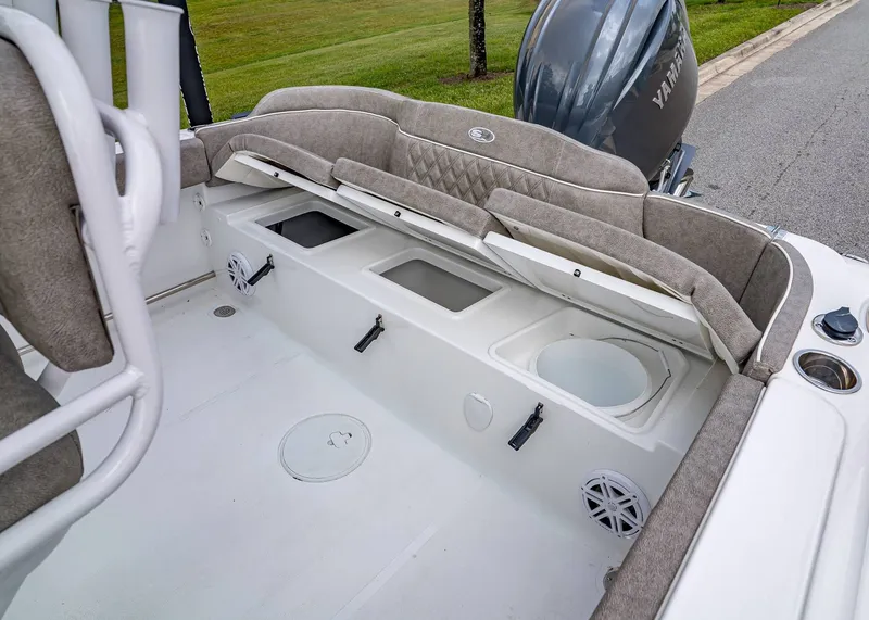 Slide: The Image of 2026 Sea Hunt Ultra 229 boat interior with storage compartments and Yamaha engine. - 6