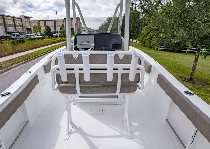 Slide: The Image of 2026 Sea Hunt Ultra 229 boat interior with seating and Garmin navigation system. - 8