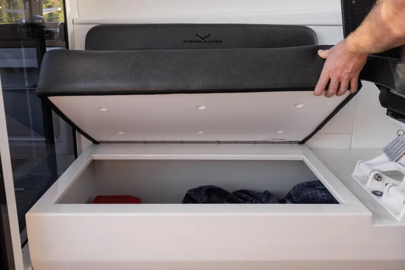 Slide: The Image of Open storage compartment on Jasper Marine Defender 22 boat, 2026 model. - 31