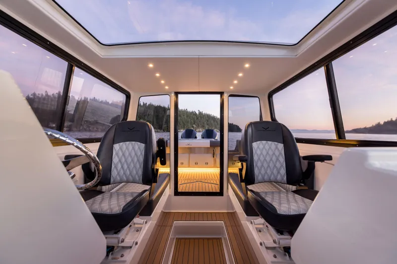 Slide: The Image of Interior of 2026 Jasper Marine Defender 22 boat with luxurious seating and panoramic windows. - 34