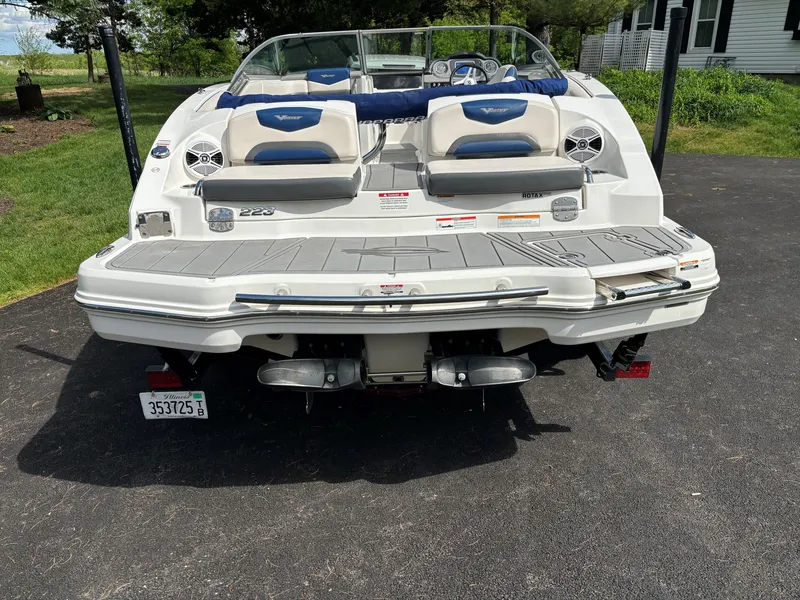 Slide: The Image of Rear view of a 2017 Chaparral Vortex 223 VR boat on a driveway. - 11