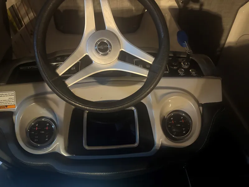 Slide: The Image of Steering console of a 2017 Chaparral Vortex 223 VR boat. - 15