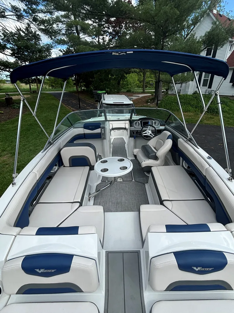 Slide: The Image of Interior view of a 2017 Chaparral Vortex 223 VR boat with blue and white seating. - 3