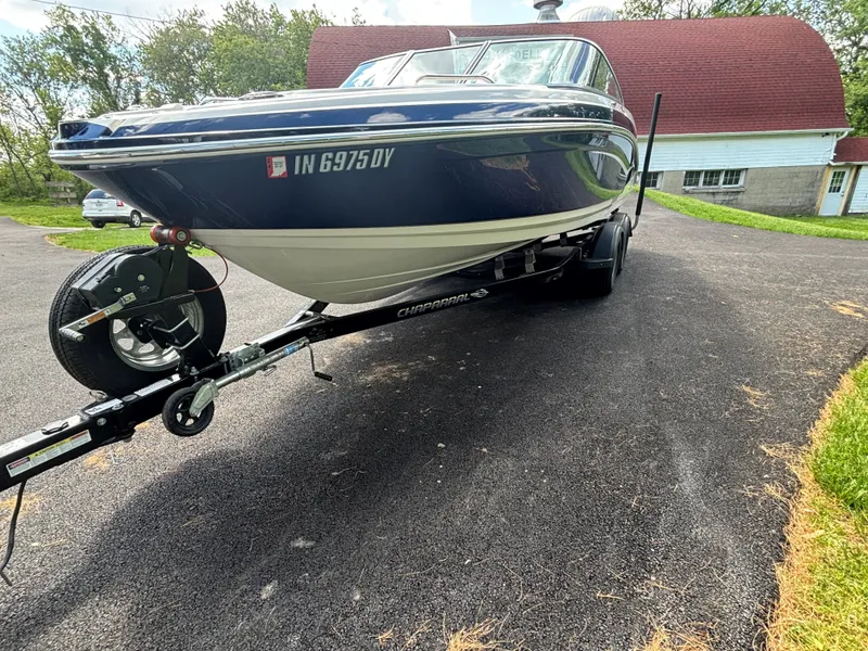 Slide: The Image of 2017 Chaparral Vortex 223 VR boat on trailer in driveway. - 7