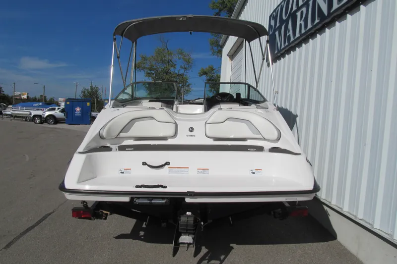 Slide: The Image of 2017 Yamaha Boats SX190 interior with white seating and steering console. - 4