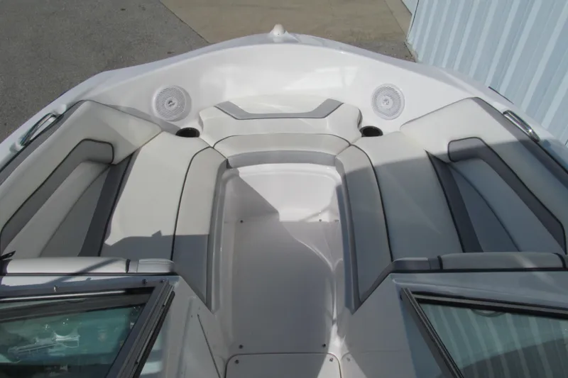 Slide: The Image of 2017 Yamaha Boats SX190 interior seating with white and gray upholstery. - 8