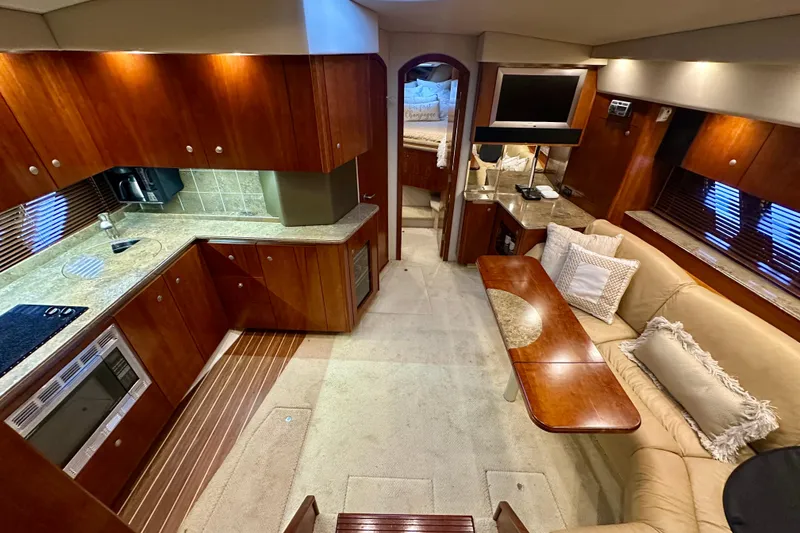 Slide: The Image of Luxurious interior of 2009 Cruisers Yachts 460 Express with elegant wood finishes and modern amenities. - 14
