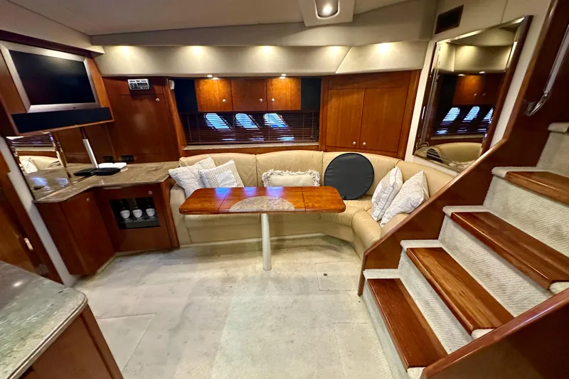 Slide: The Image of Luxurious interior of 2009 Cruisers Yachts 460 Express with cozy seating and elegant wood finishes. - 16