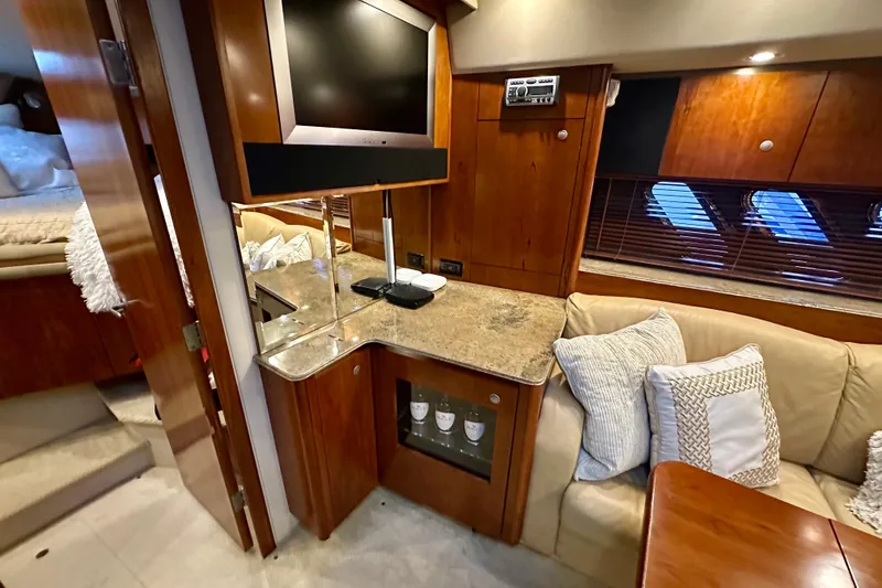 Slide: The Image of Luxurious 2009 Cruisers Yachts 460 Express interior with cozy seating and modern amenities. - 18