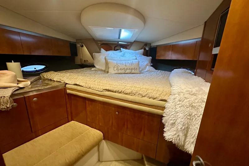 Slide: The Image of Luxurious cabin interior of 2009 Cruisers Yachts 460 Express with cozy bedding. - 19