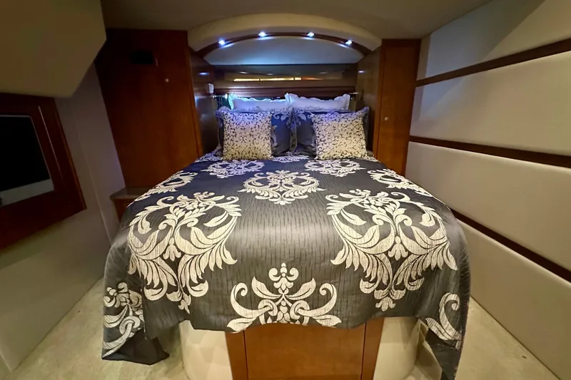 Slide: The Image of Luxurious bedroom interior of 2009 Cruisers Yachts 460 Express with elegant bedding. - 23