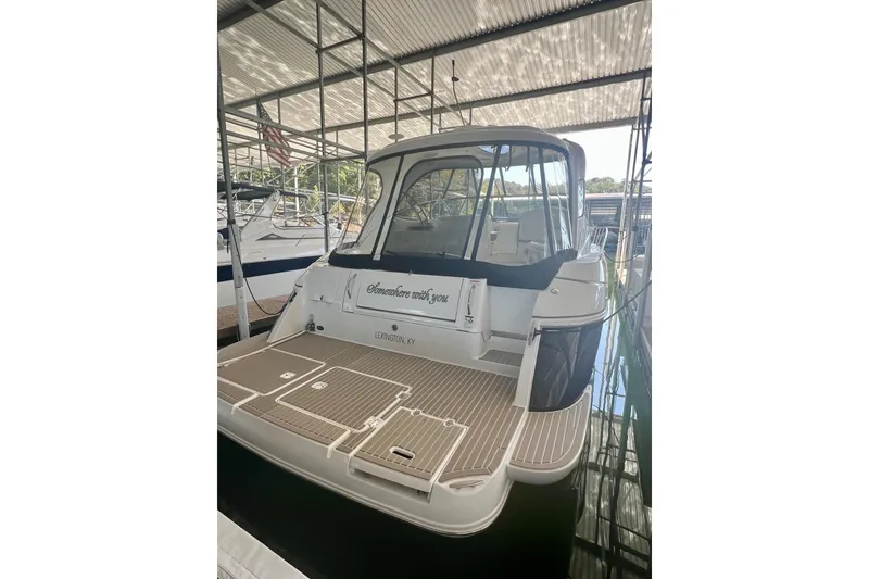 Slide: The Image of 2009 Cruisers Yachts 460 Express docked, rear view with Lexington, KY signage. - 40