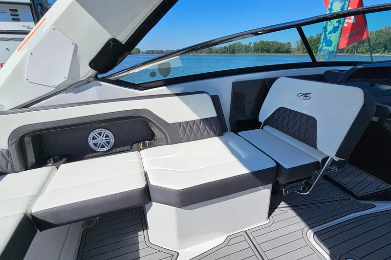 Slide: The Image of 2019 Monterey 305SS Super Sport boat interior with white seating and lake view. - 12