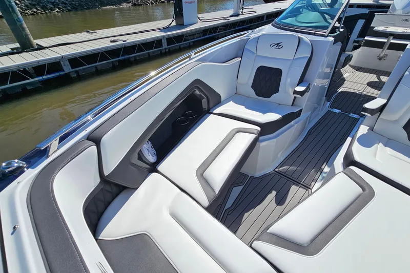 Slide: The Image of 2019 Monterey 305SS Super Sport boat interior with luxurious seating and sleek design. - 26