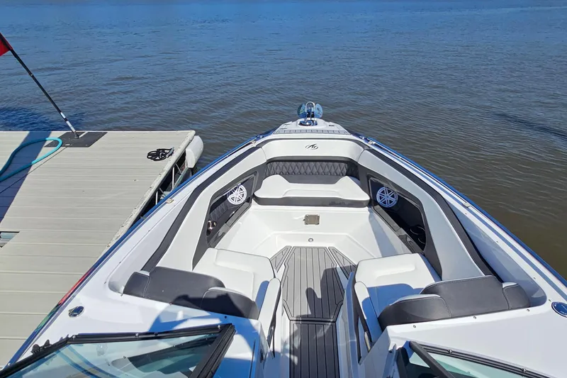 Slide: The Image of 2019 Monterey 305SS Super Sport boat docked by calm waters. - 29