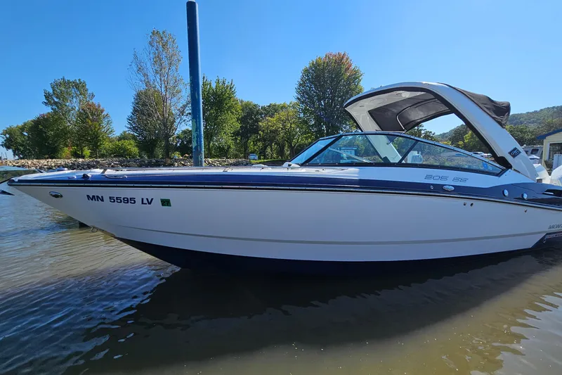 Slide: The Image of 2019 Monterey 305SS Super Sport boat docked on a sunny day. - 3