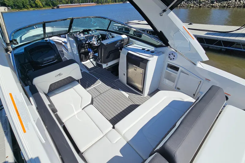 Slide: The Image of 2019 Monterey 305SS Super Sport boat interior with luxurious seating and modern amenities. - 9