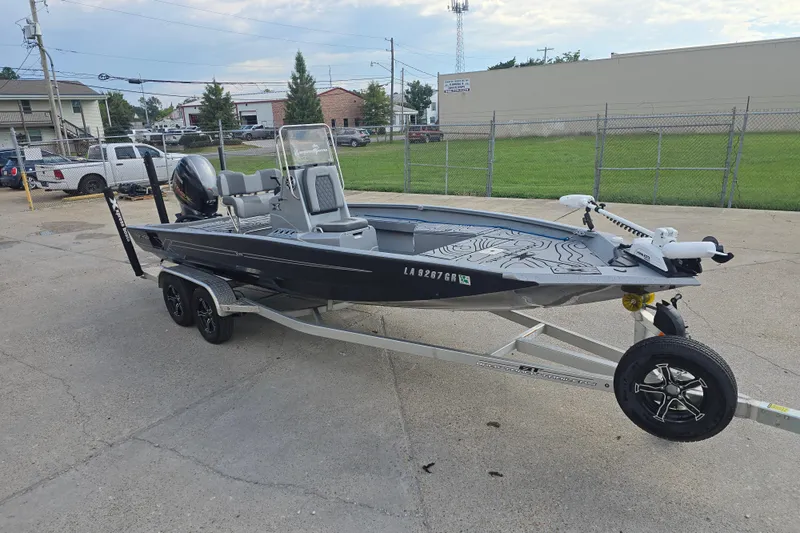 Slide: The Image of 2024 Xpress H22B Bay boat on trailer, parked in an urban setting. - 4