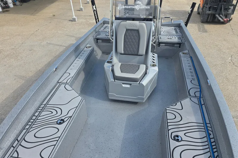 Slide: The Image of 2024 Xpress H22B Bay boat interior with modern seating and storage compartments. - 9