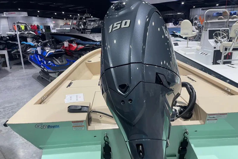 Slide: The Image of 2024 G3 Bay 20 GX boat with 150 HP engine in showroom. - 4
