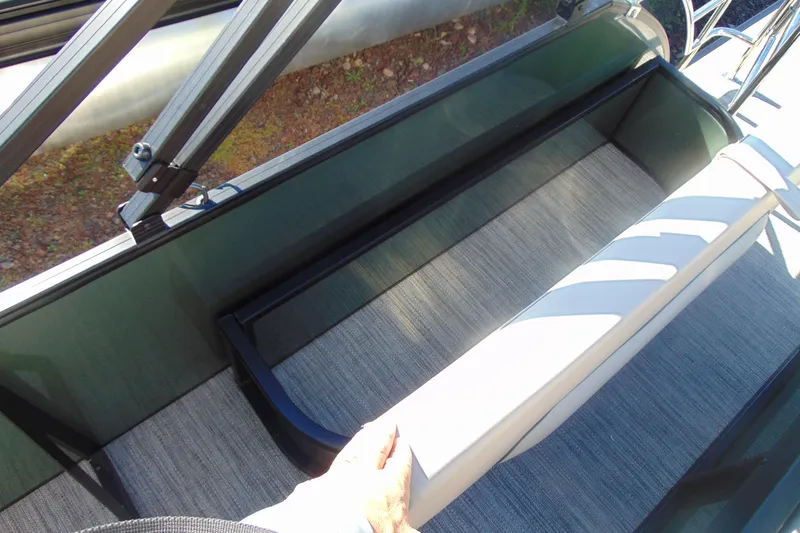 Slide: The Image of 2026 Godfrey SWEETWATER 2286 SFL boat interior with seating and flooring detail. - 16