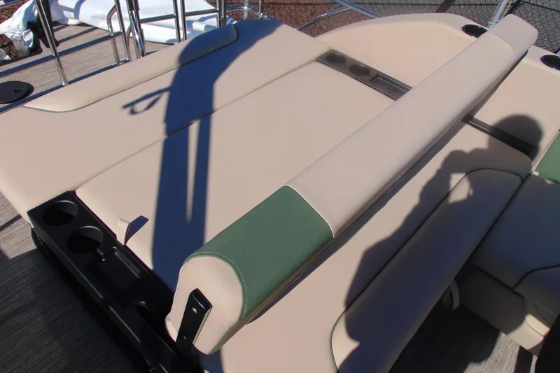 Slide: The Image of 2026 Godfrey SWEETWATER 2286 SFL boat seating with beige and green upholstery. - 17