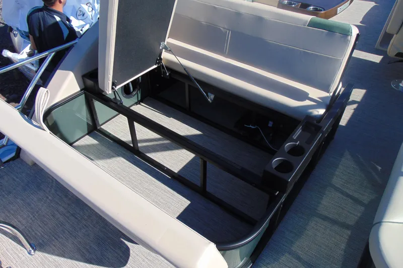 Slide: The Image of 2026 Godfrey SWEETWATER 2286 SFL boat interior with open storage compartment and seating. - 20