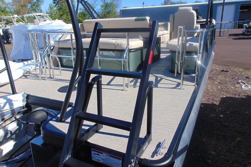 Slide: The Image of 2026 Godfrey SWEETWATER 2286 SFL pontoon boat with ladder and seating area. - 3