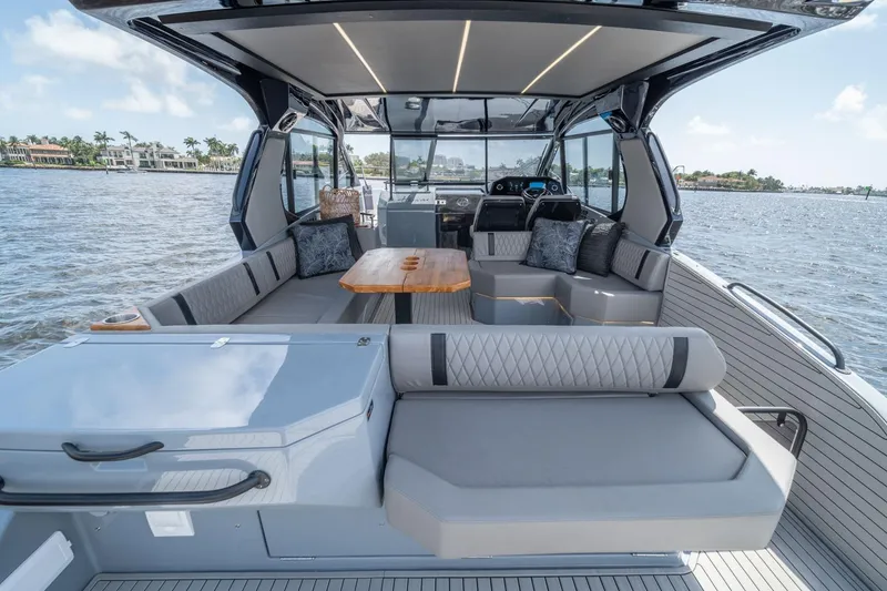 Slide: The Image of Luxurious 2026 Hanover 387 yacht interior with elegant seating and scenic water view. - 10