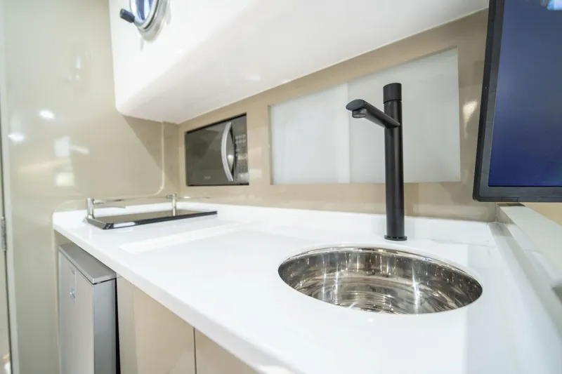 Slide: The Image of Modern kitchen area in 2026 Hanover 387, featuring sleek sink and microwave. - 28