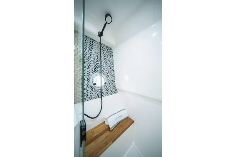 Slide: The Image of Modern shower with mosaic tiles and wooden bench in Hanover 387, 2026 model. - 34