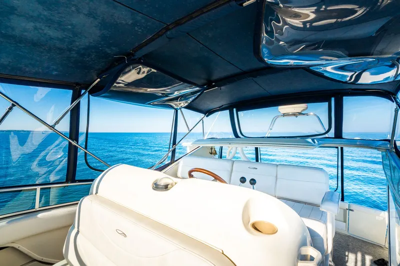 Slide: The Image of Interior view of 1999 Maxum 4100 SCA Motor Yacht with ocean backdrop. - 22