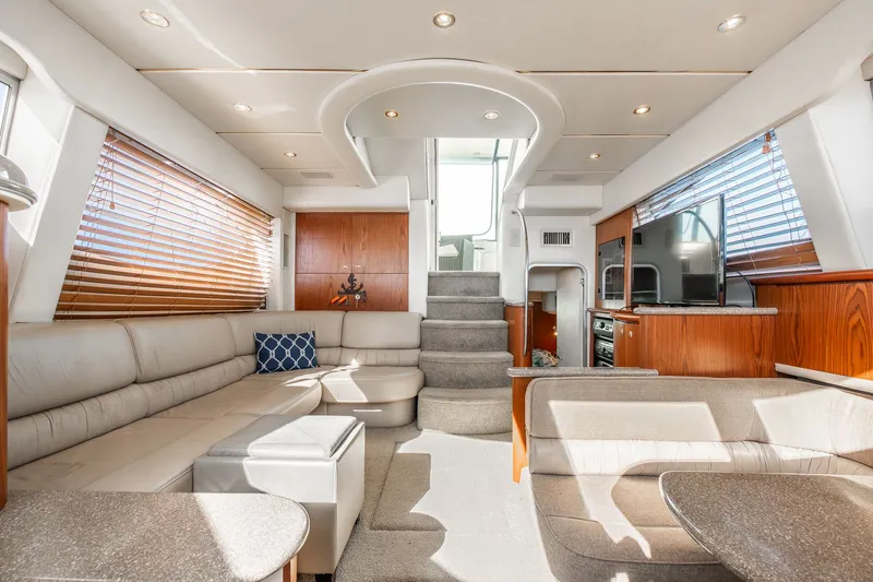 Slide: The Image of Luxurious interior of 1999 Maxum 4100 SCA Motor Yacht with modern furnishings and natural light. - 31