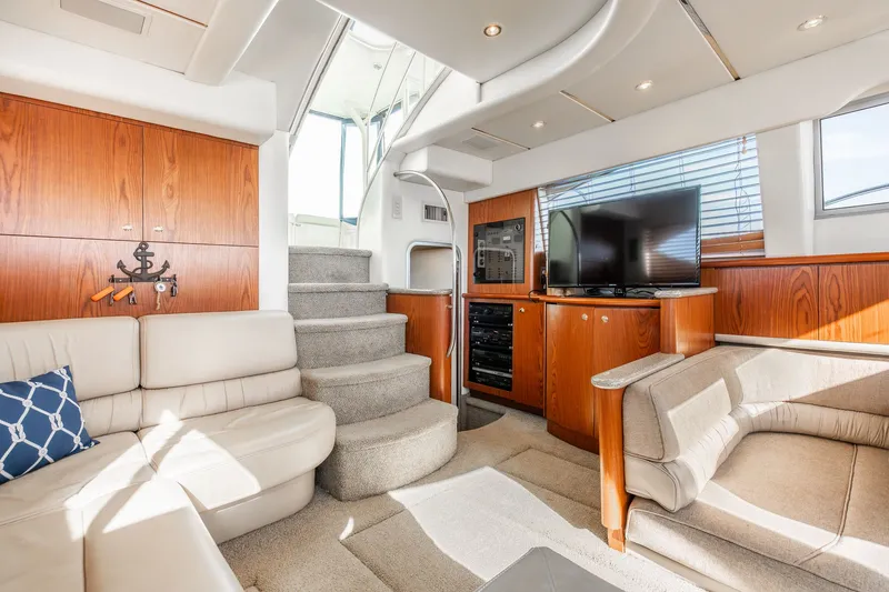 Slide: The Image of Luxurious interior of 1999 Maxum 4100 SCA Motor Yacht with plush seating and modern amenities. - 32