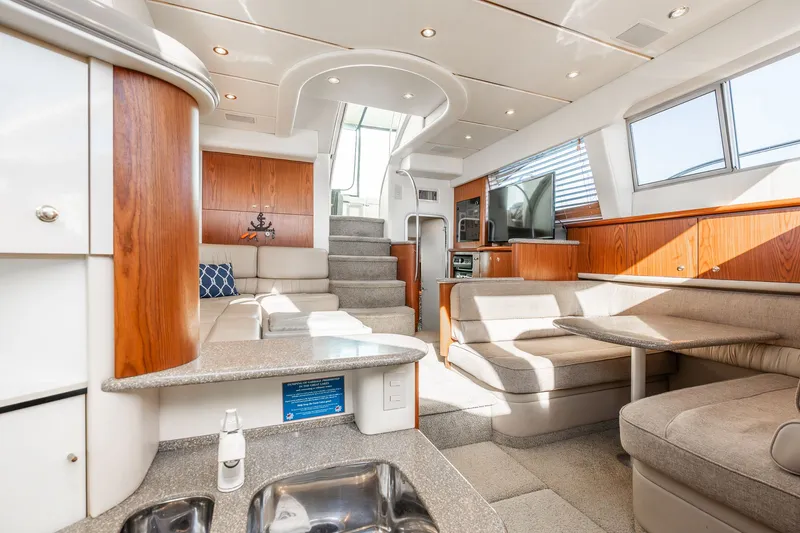 Slide: The Image of Luxurious interior of 1999 Maxum 4100 SCA Motor Yacht with modern furnishings and natural light. - 34