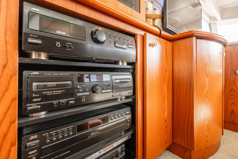 Slide: The Image of Audio equipment in wooden cabinet on 1999 Maxum 4100 SCA Motor Yacht. - 36