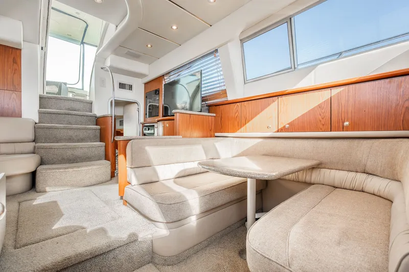 Slide: The Image of Interior of 1999 Maxum 4100 SCA Motor Yacht with cozy seating and modern amenities. - 40