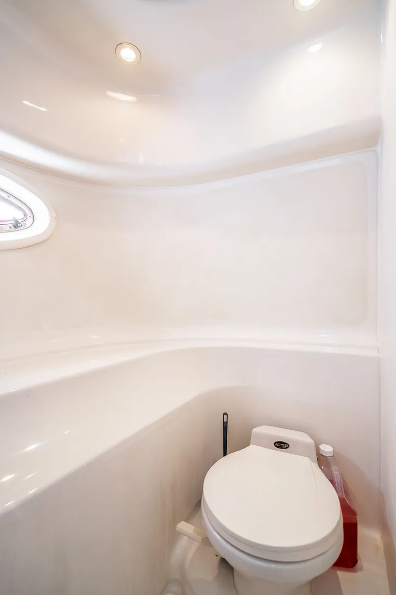 Slide: The Image of 1999 Maxum 4100 SCA Motor Yacht bathroom with white fixtures and overhead lighting. - 46