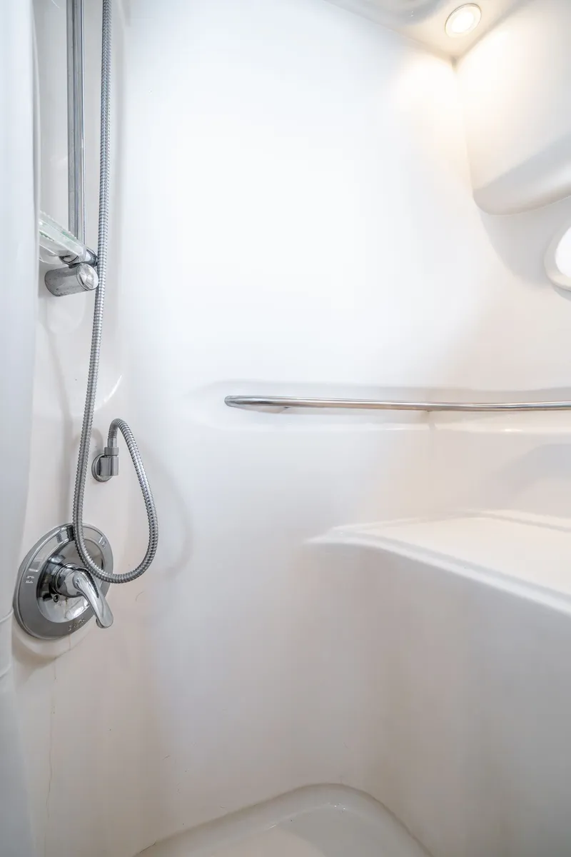Slide: The Image of Shower area in 1999 Maxum 4100 SCA Motor Yacht, featuring sleek design and modern fixtures. - 47