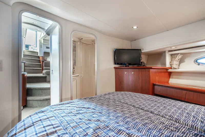 Slide: The Image of Interior of 1999 Maxum 4100 SCA Motor Yacht with cozy bedroom and TV. - 49