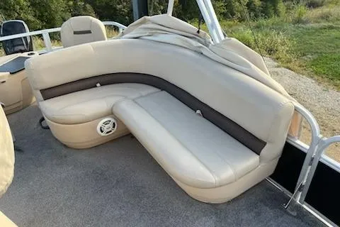Slide: The Image of 2019 Sun Tracker Bass Buggy 18 DLX pontoon boat with beige seating and speaker. - 10