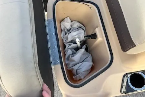 Slide: The Image of Storage compartment in a 2019 Sun Tracker Bass Buggy 18 DLX boat with fabric inside. - 3