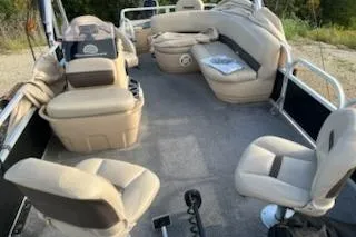 Slide: The Image of 2019 Sun Tracker Bass Buggy 18 DLX pontoon boat interior with beige seating. - 5