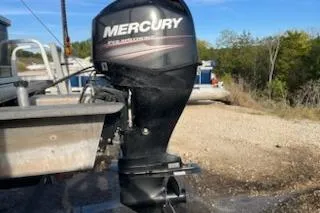 Slide: The Image of 2019 Sun Tracker Bass Buggy 18 DLX with Mercury outboard motor in outdoor setting. - 7