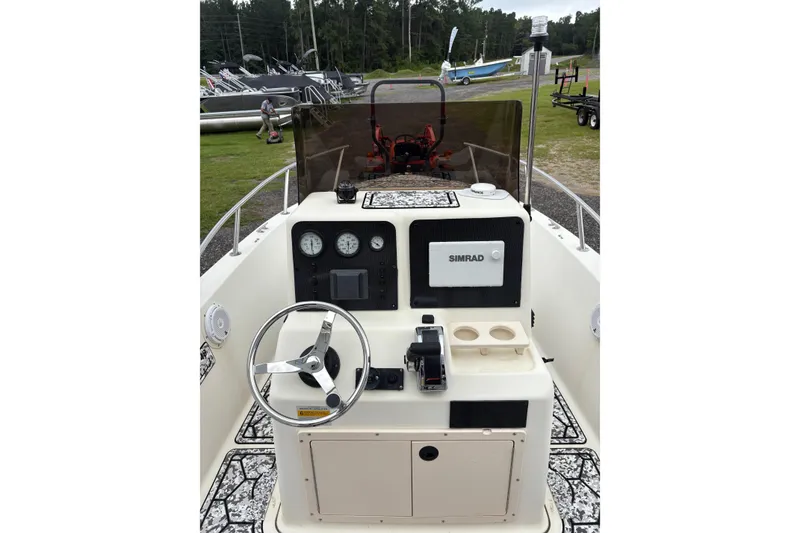 Slide: The Image of 1999 Sea Pro 180 Center Console boat dashboard with steering wheel and navigation equipment. - 6