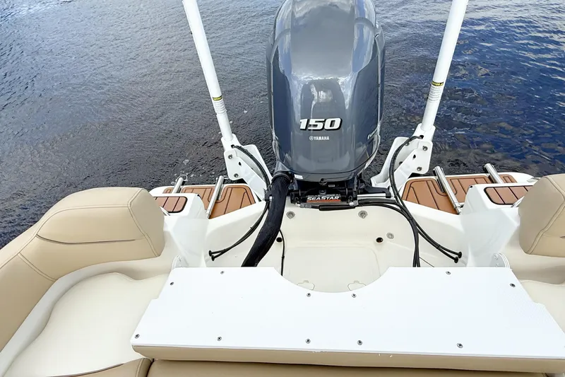 Slide: The Image of 2020 Pioneer 202 Islander boat with Yamaha 150 engine on calm water. - 13
