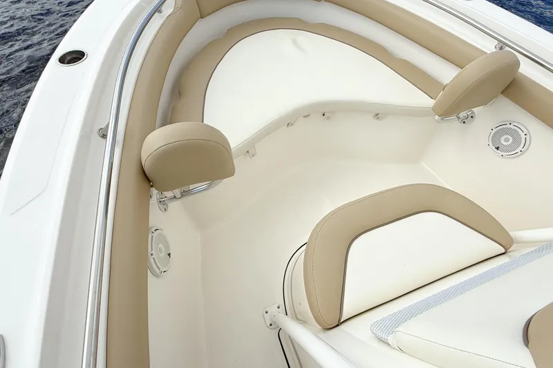 Slide: The Image of Interior seating of 2020 Pioneer 202 Islander boat with beige and white upholstery. - 14