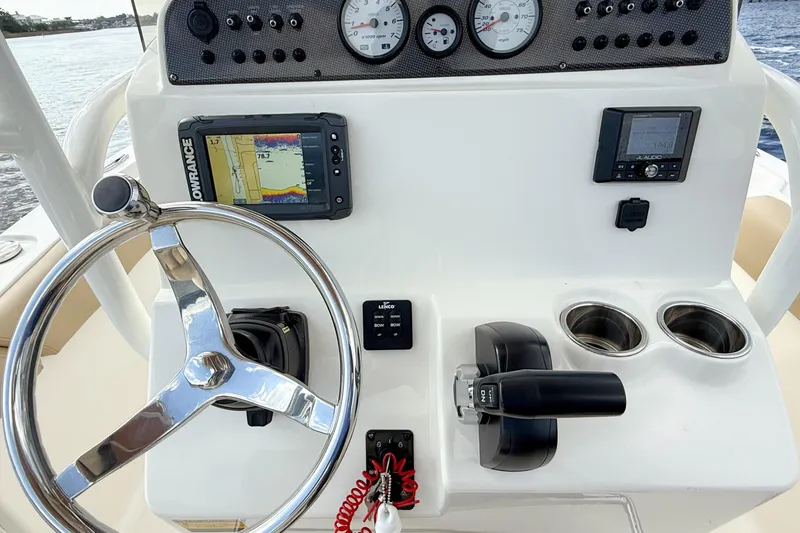 Slide: The Image of Steering console of 2020 Pioneer 202 Islander boat with navigation equipment and controls. - 18