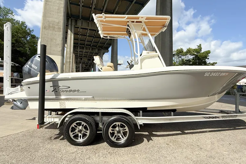 Slide: The Image of 2020 Pioneer 202 Islander boat on trailer, under bridge, sunny day. - 4